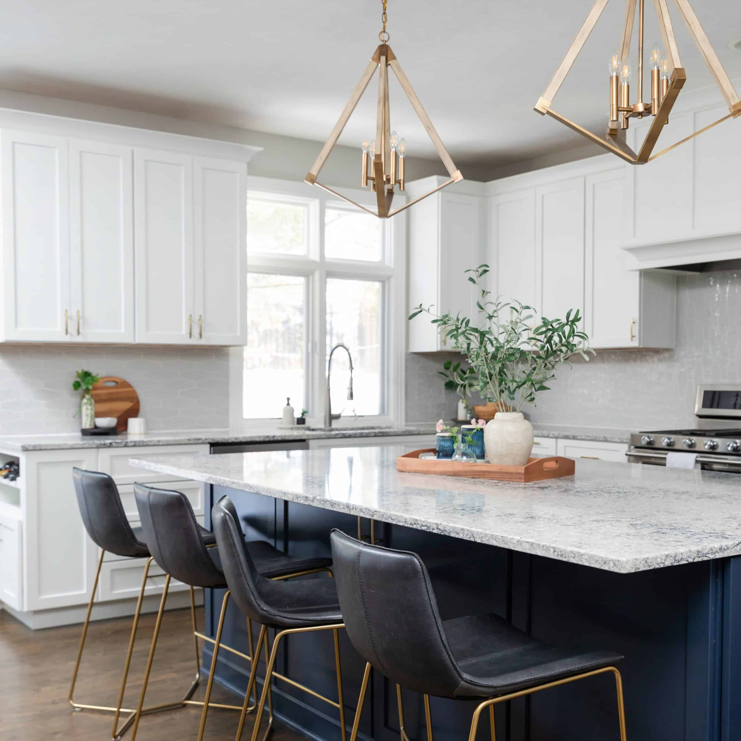 Picture of kitchen remodel with quartz stone countertop island, light fixtures, sink, cabinets, and seating area