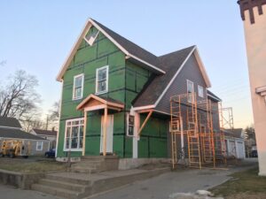 Almost finished exterior of new home after fire damage insurance claim