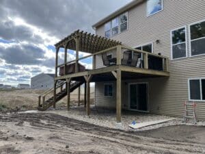 deck with composite decking and treated lumber pergola