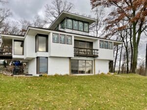 second story addition on lake viewed from exterior with new windows